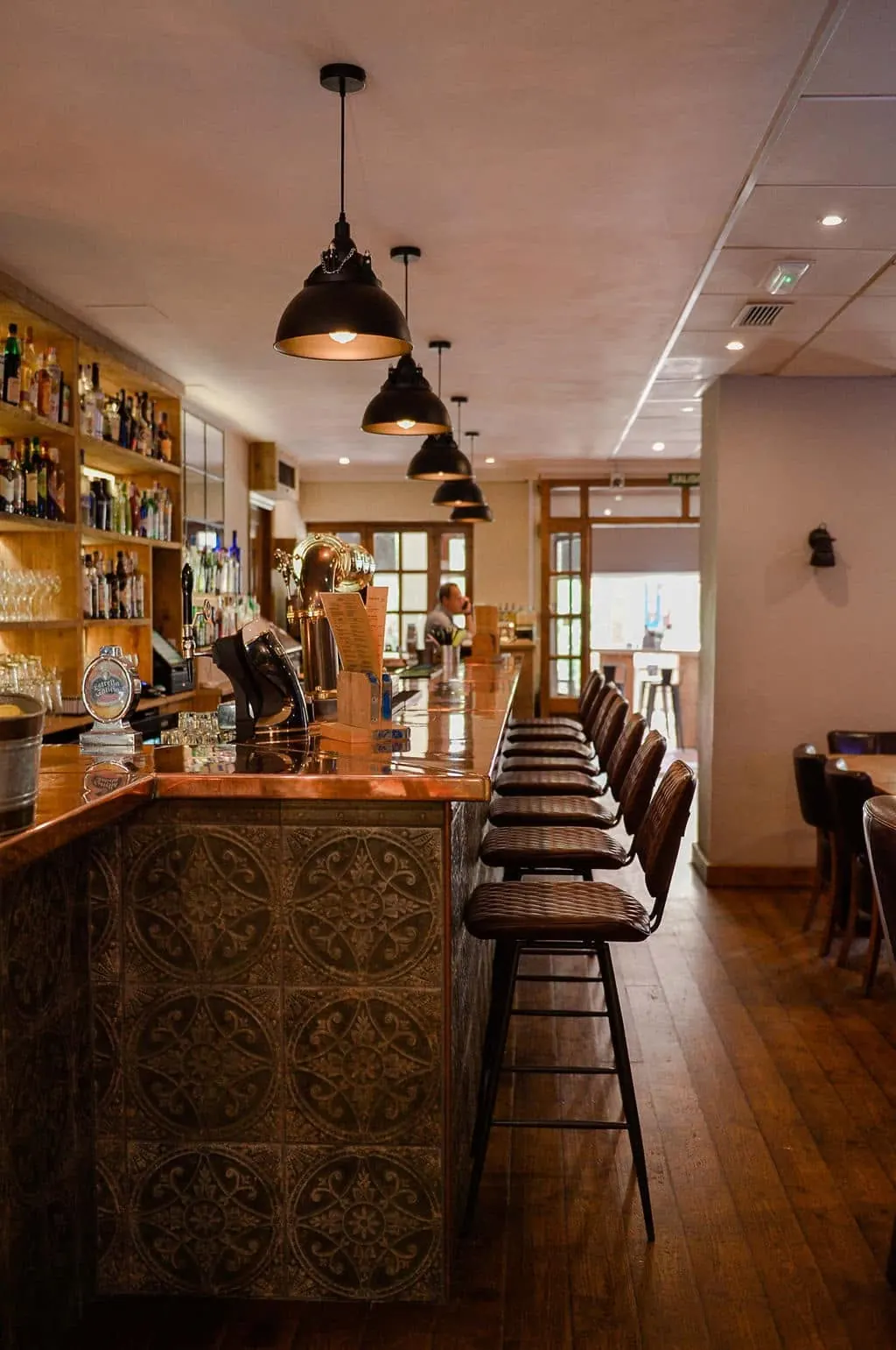 The long wooden bar inside The Hairy Lemon