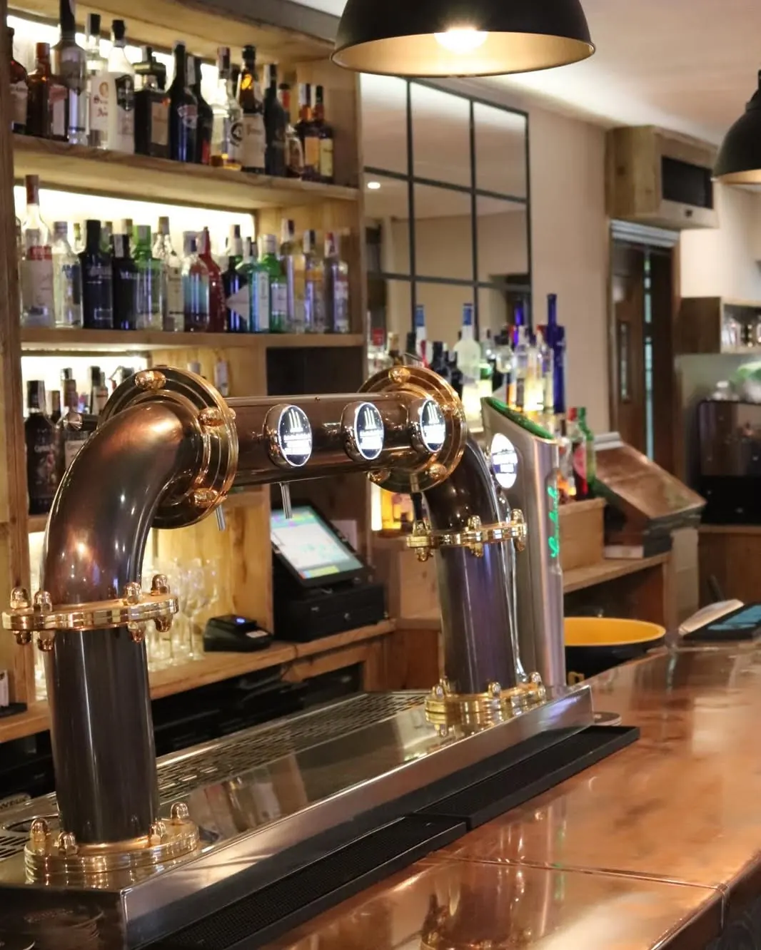 Brass beer taps along the bar