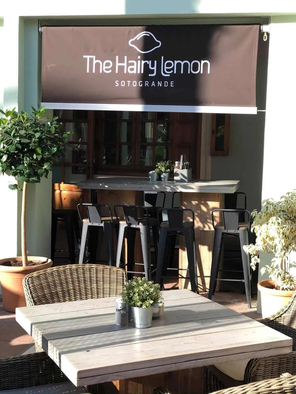 The Hairy Lemon frontage and terrace tables on the plaza