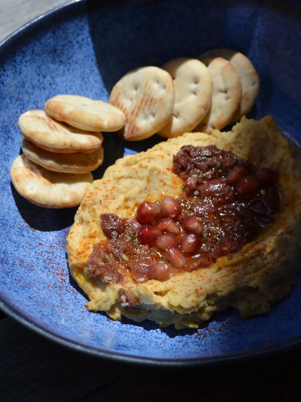 A sharing plate of hummus and warm flatbreads